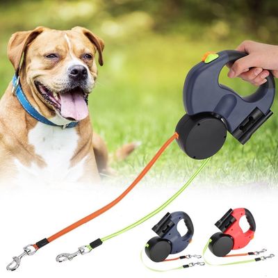 Ceinture élastique résistante de double laisse escamotable réfléchie de chien avec des sacs de dunette de lampe-torche de LED