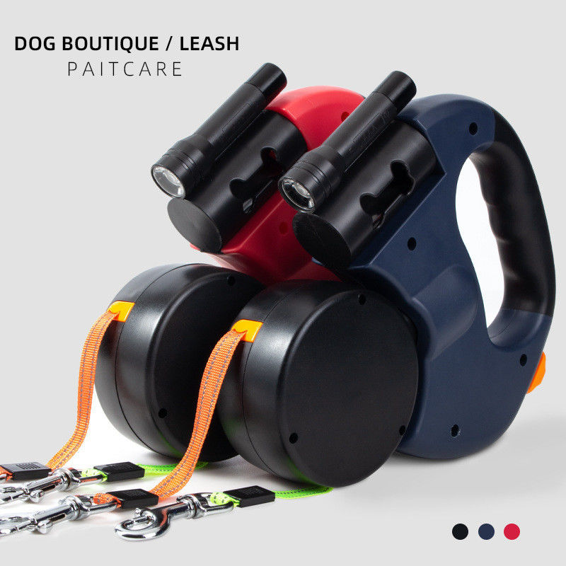 Ceinture élastique résistante de double laisse escamotable réfléchie de chien avec des sacs de dunette de lampe-torche de LED
