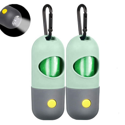 La pilule forment le distributeur de support de sac de déchets de chien de dunette d'animal familier de lampe-torche de LED